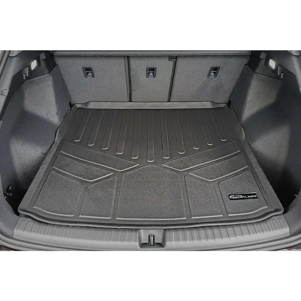 Custom-fit Audi trunk liner mat installed in rear cargo area, durable protective design
