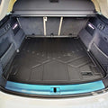 Audi SUV trunk with fitted black Smartliner cargo liner, protective mat, and netted storage pockets