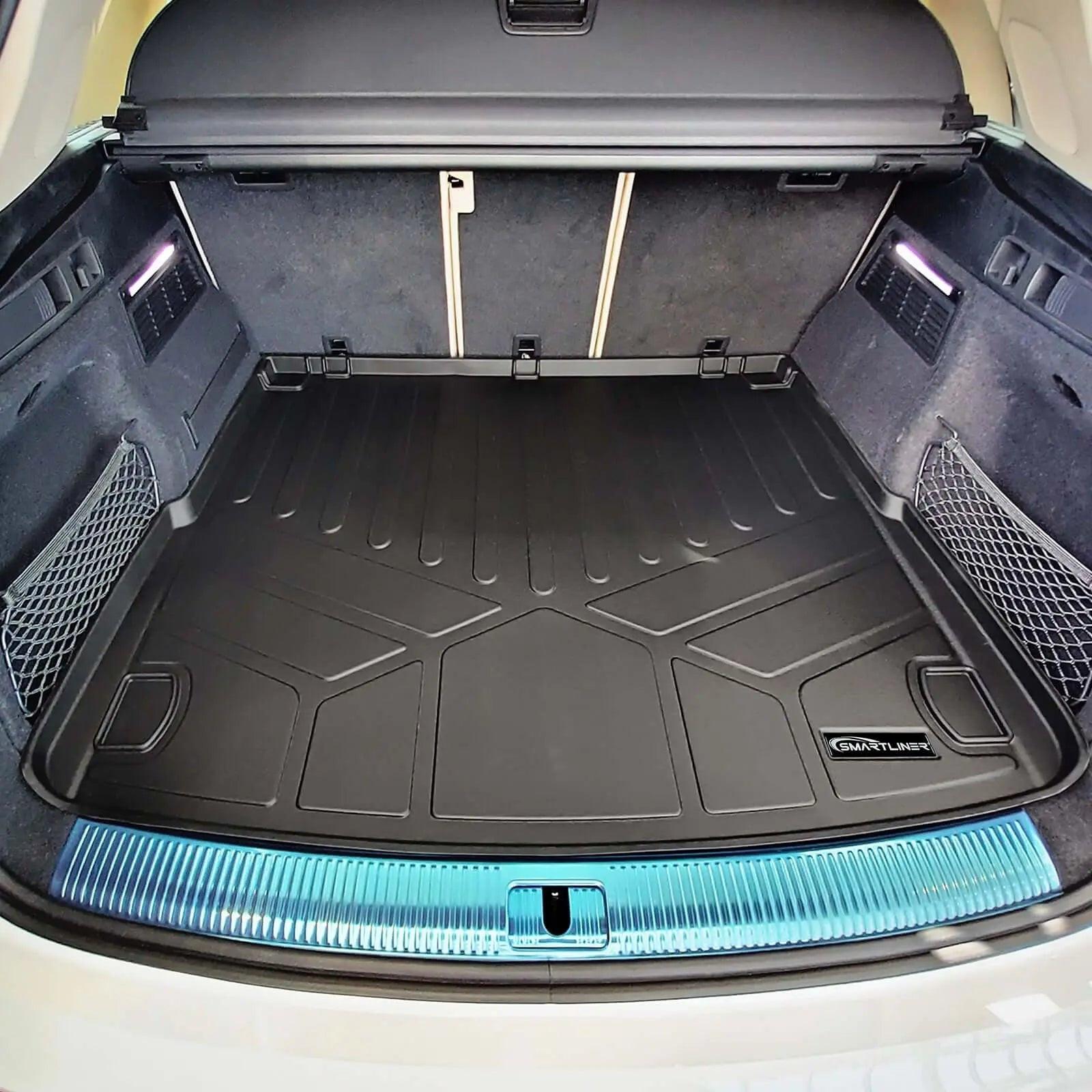 Audi SUV trunk with fitted black Smartliner cargo liner, protective mat, and netted storage pockets