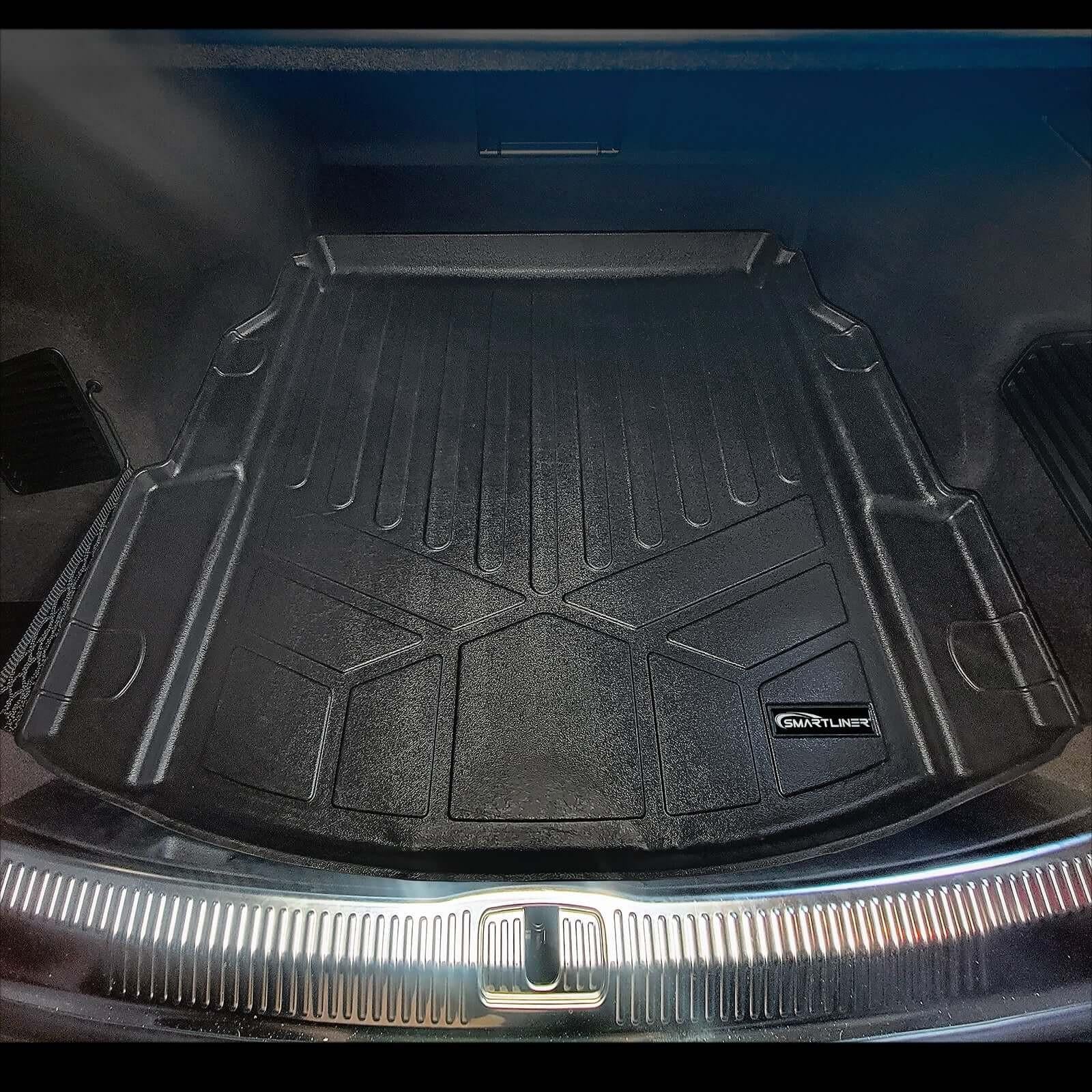 Audi trunk with fitted black Smartliner cargo mat, durable and custom molded for protection