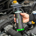 Hand holding Wash & Whips Green Hell engine cleaner and degreaser in car engine bay