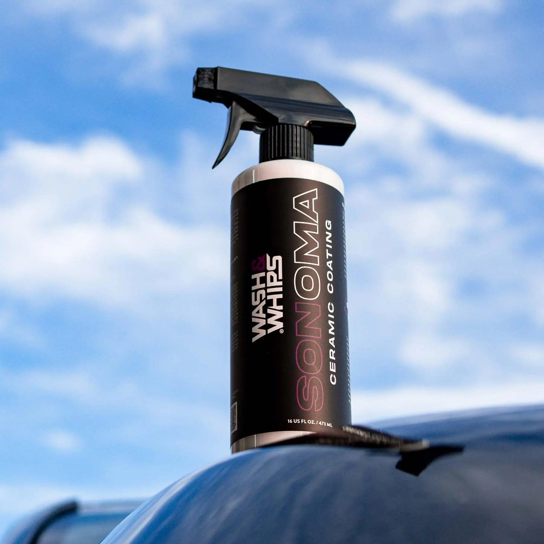 Wash & Whips Sonoma ceramic coating spray bottle on car roof with sky background