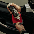 WASH&WHIPS Monza leather coating and conditioner bottle shown, designed to clean and condition leather surfaces.