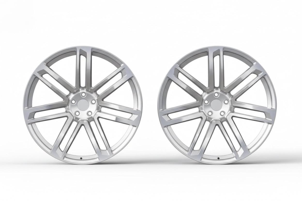 Pair of silver multi-spoke alloy wheels for Audi performance upgrade on white background