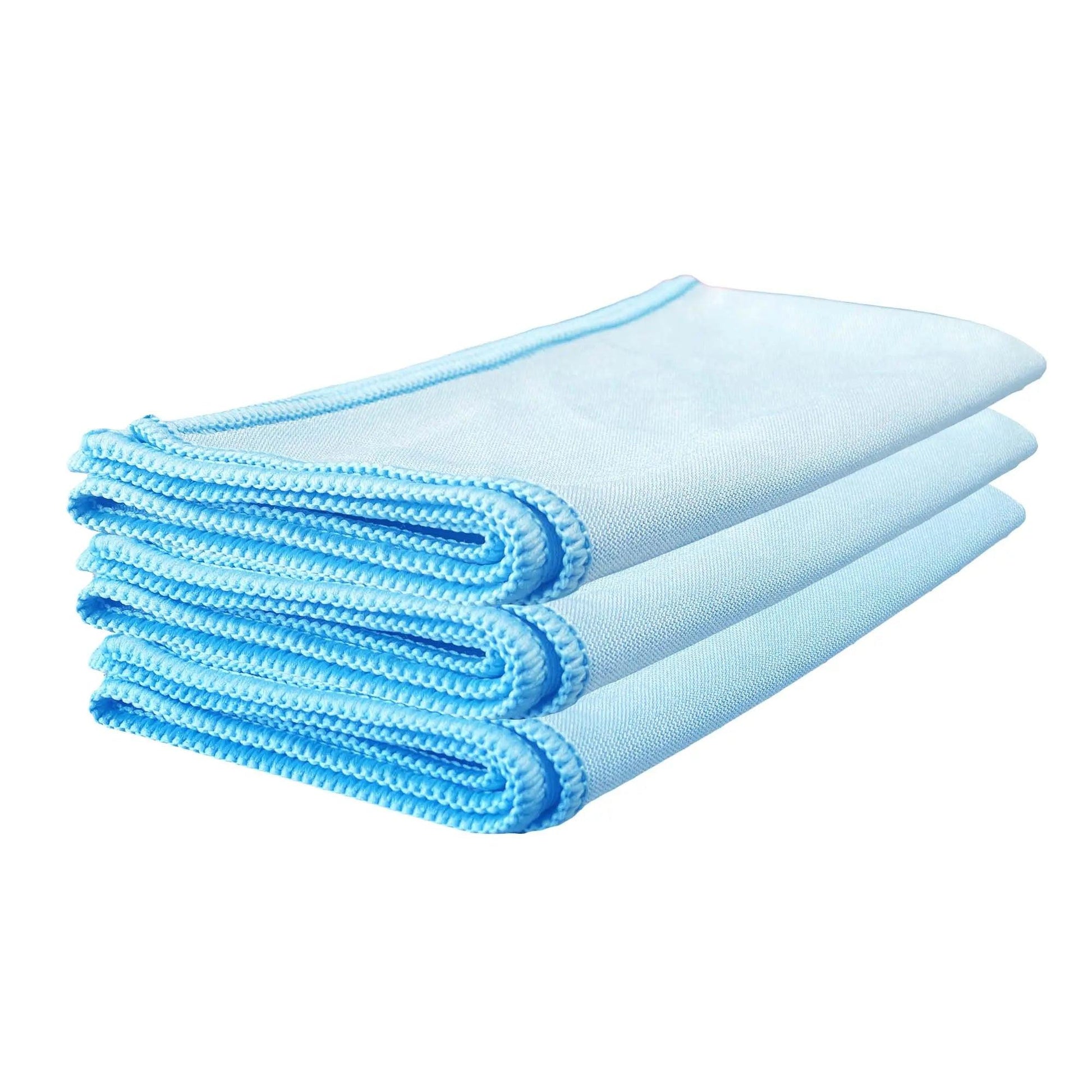 Stack of three light blue microfiber glass towels for car cleaning on white background