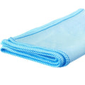 Folded blue microfiber towel for car glass cleaning, close-up on smooth fabric texture