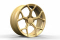 Gold forged alloy wheel with modern multi-spoke design for performance cars