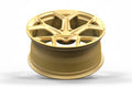 Gold alloy wheel with modern multi-spoke design for Audi performance vehicles