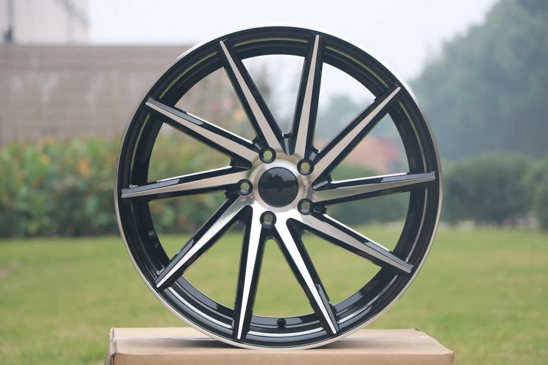 20-inch swirl style wheels by WheeloutletNJ showing polished chrome finish and intricate swirl pattern design.
