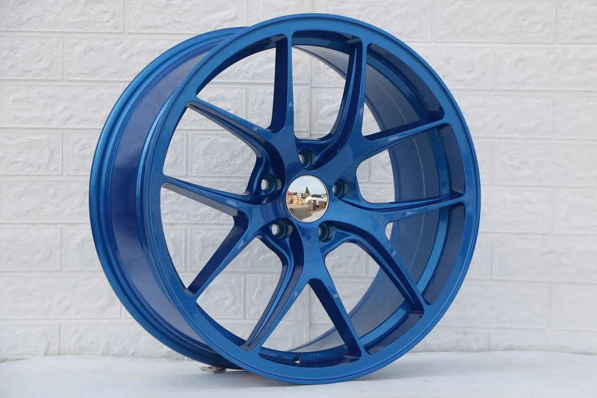 Blue 19-inch Vortex Style Wheels by WheeloutletNJ with a sleek, modern design for enhanced vehicle performance and style.