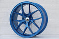 Blue 19-inch Vortex Style Wheels by WheeloutletNJ, showcasing sleek, aerodynamic design and vibrant finish.