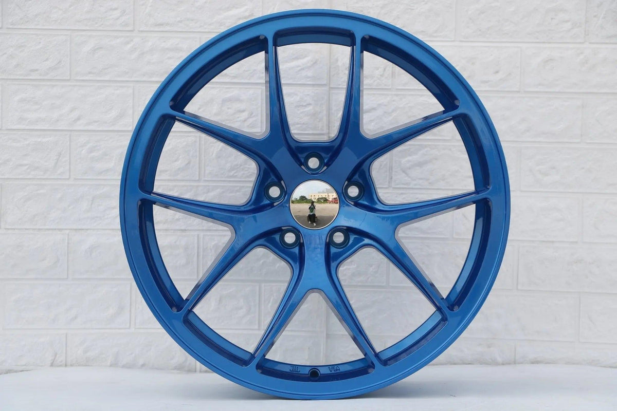 Blue 19-inch Vortex Style wheels by WheeloutletNJ, showcasing sleek, modern design with a polished finish.