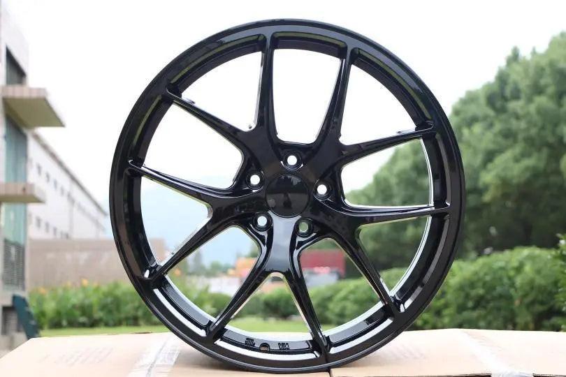 Gloss black 20-inch Vortex Style wheels by WheeloutletNJ featuring a sleek, modern design for cars.