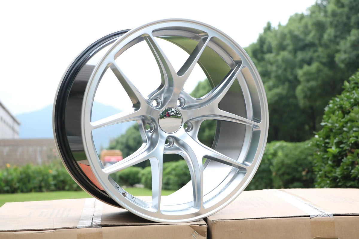 19-inch Vortex Style WheeloutletNJ black wheels with a sleek, modern design and hyper black finish.