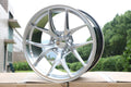 19-inch Vortex style wheels in glossy black finish, featuring a bold, multi-spoke design for a sleek, modern look.