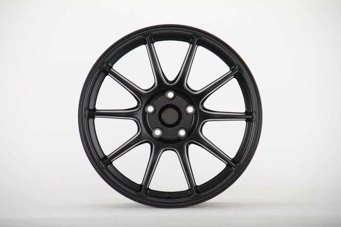 Matte black multi-spoke performance alloy wheel for Audi, isolated on white background