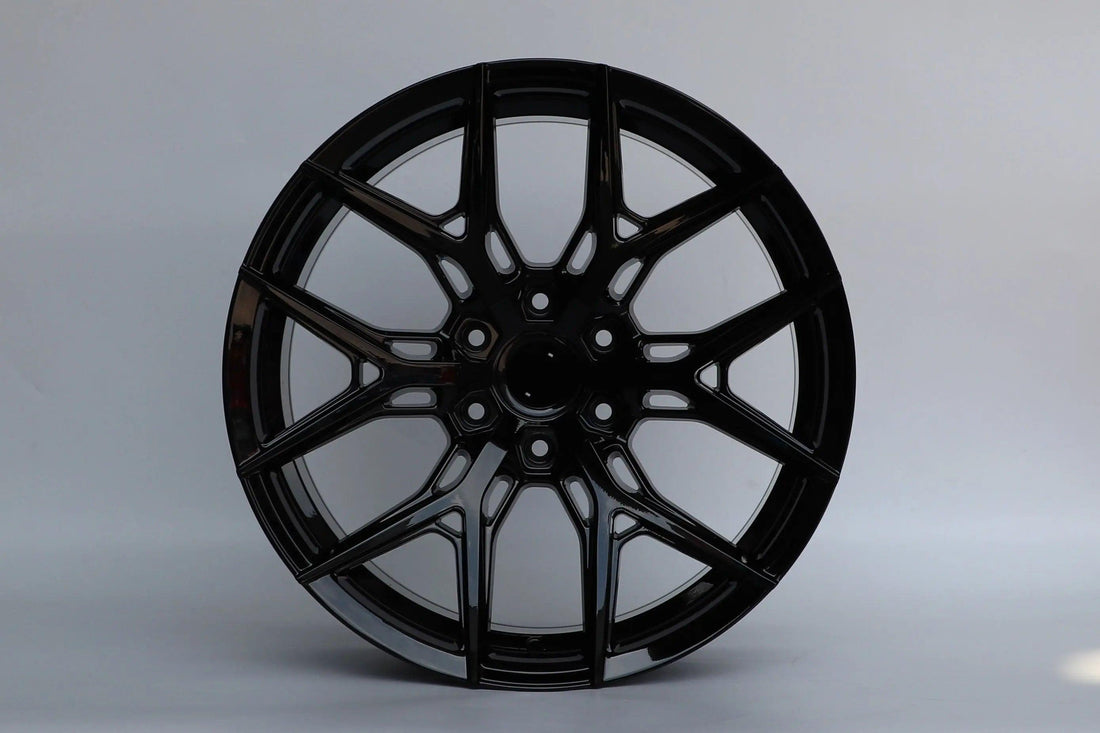 20-inch HF5 Style wheels by WheeloutletNJ, featuring a sleek design with a glossy black finish and modern multi-spoke appearance.