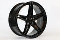 18-inch WheeloutletNJ IPW 1546 alloy wheel with a glossy black finish and silver accents, featuring a multi-spoke design.