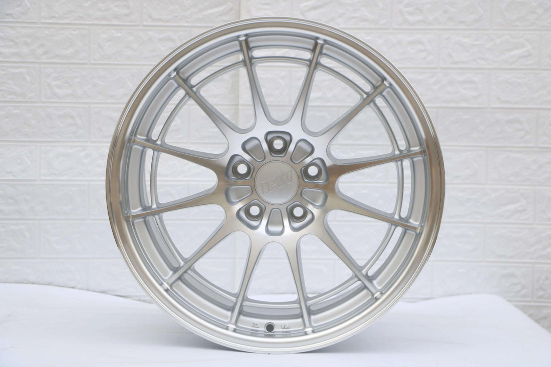 15 inch silver multi-spoke alloy wheel NT03 style, close-up against white background