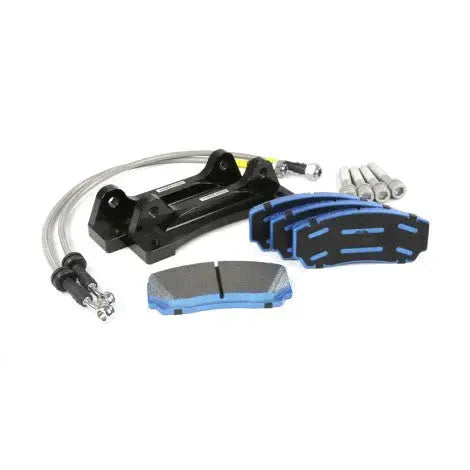 High-performance Audi brake kit with caliper bracket, brake pads, bolts, and braided lines