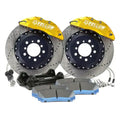Yellow front big brake kit with calipers, rotors, pads, and hardware for performance cars