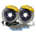Performance brake kit with yellow calipers, drilled rotors, pads, and hardware for Audi