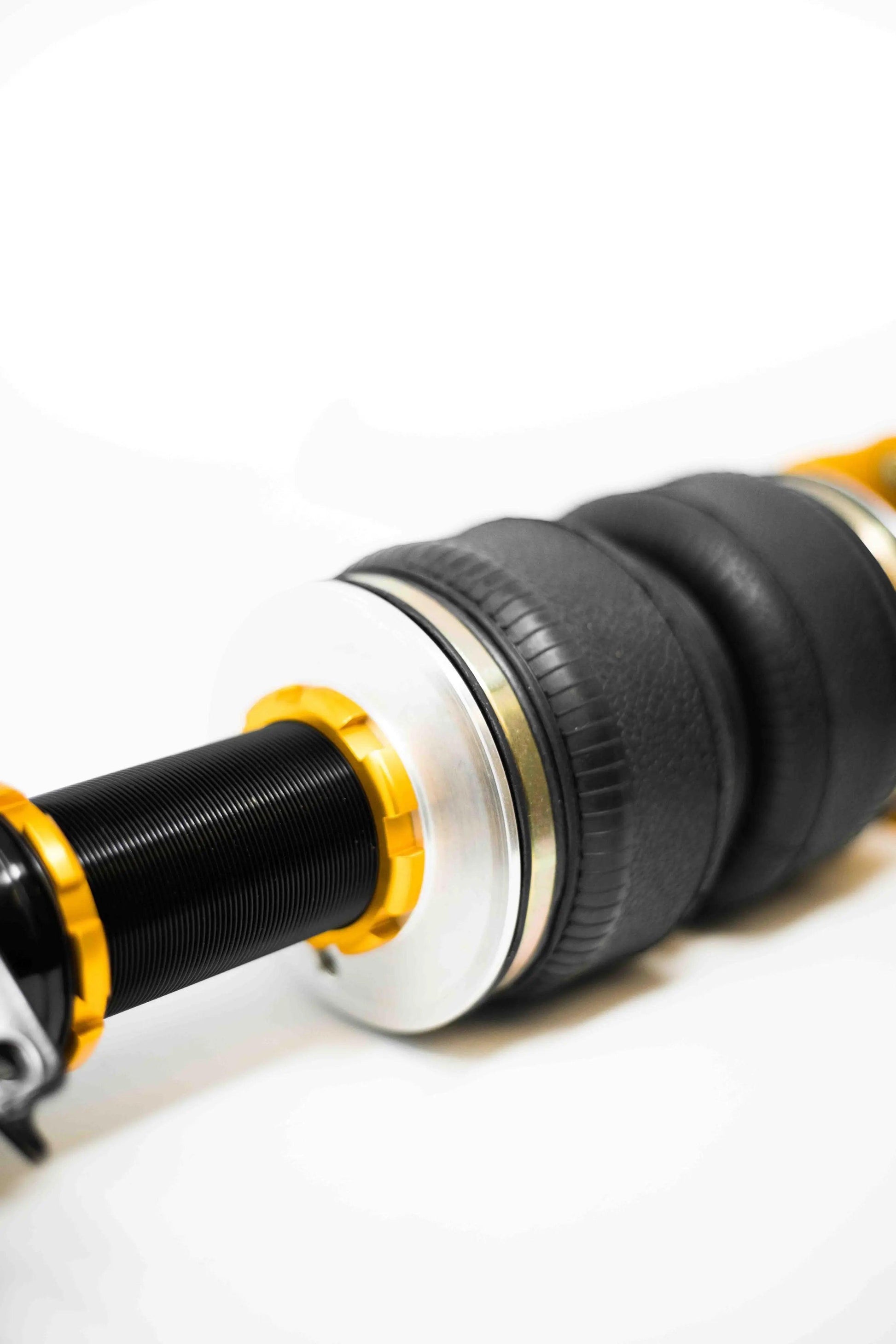 Yellow Speed Racing Dynamic Pro Air Struts for Audi S3 2015-2026, showing close-up of low perch design and branding on the air struts.