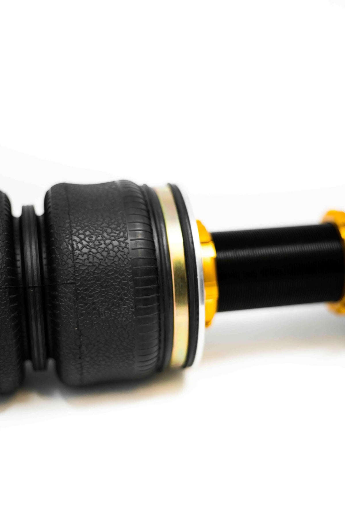 Yellow Speed Racing Audi A6 Quattro 1997-2005 air struts, Dynamic Pro Air Struts, showing close-up of low perch design.