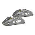 Pair of grey YSR performance brake calipers for Audi, automotive parts on white background