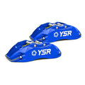 Pair of blue YSR high performance automotive brake calipers on white background