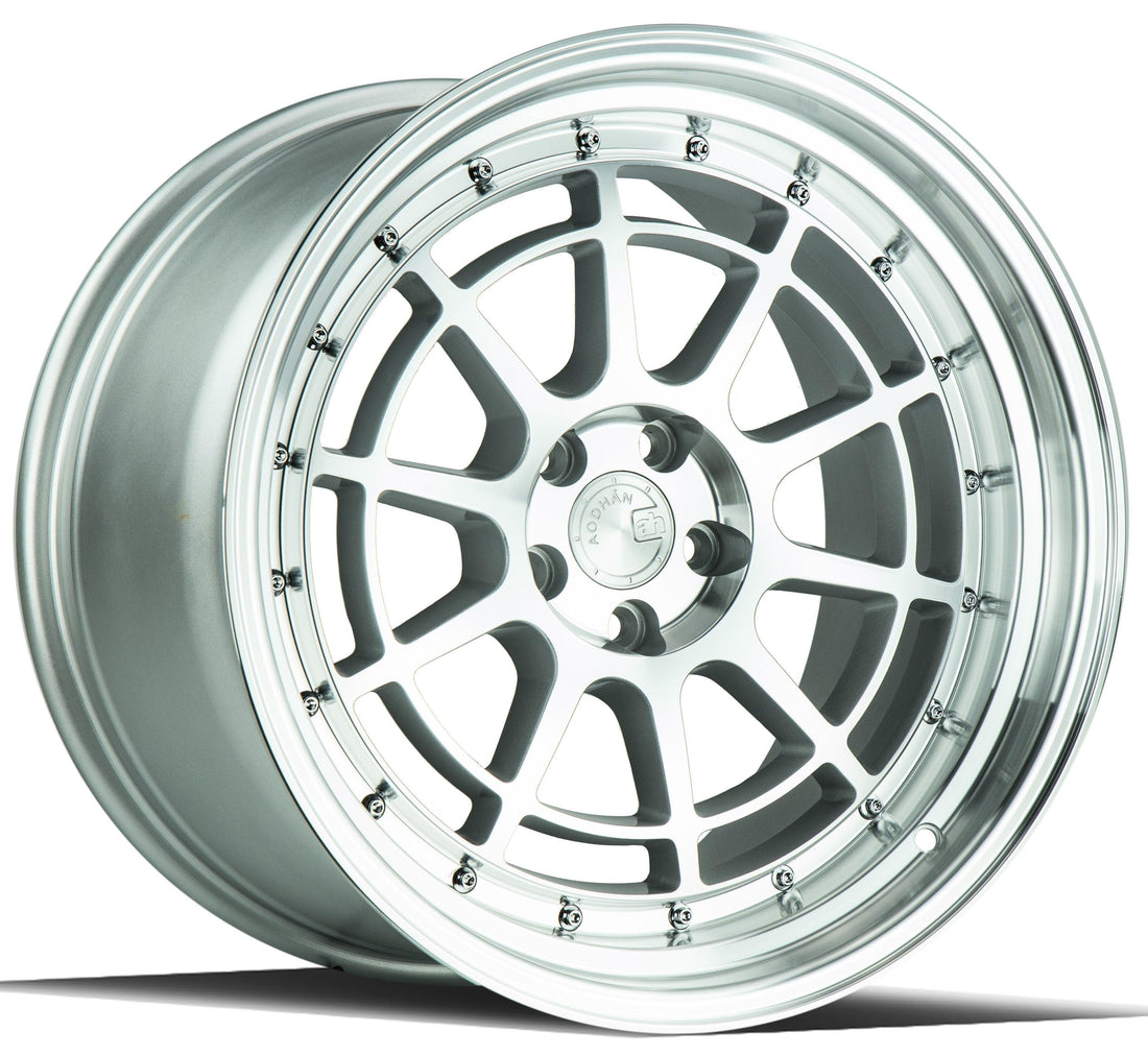 Aodhan Wholesale AH04 15x8 silver machined face wheels with 4x100 and 4x114 bolt patterns on a car wheel rim.