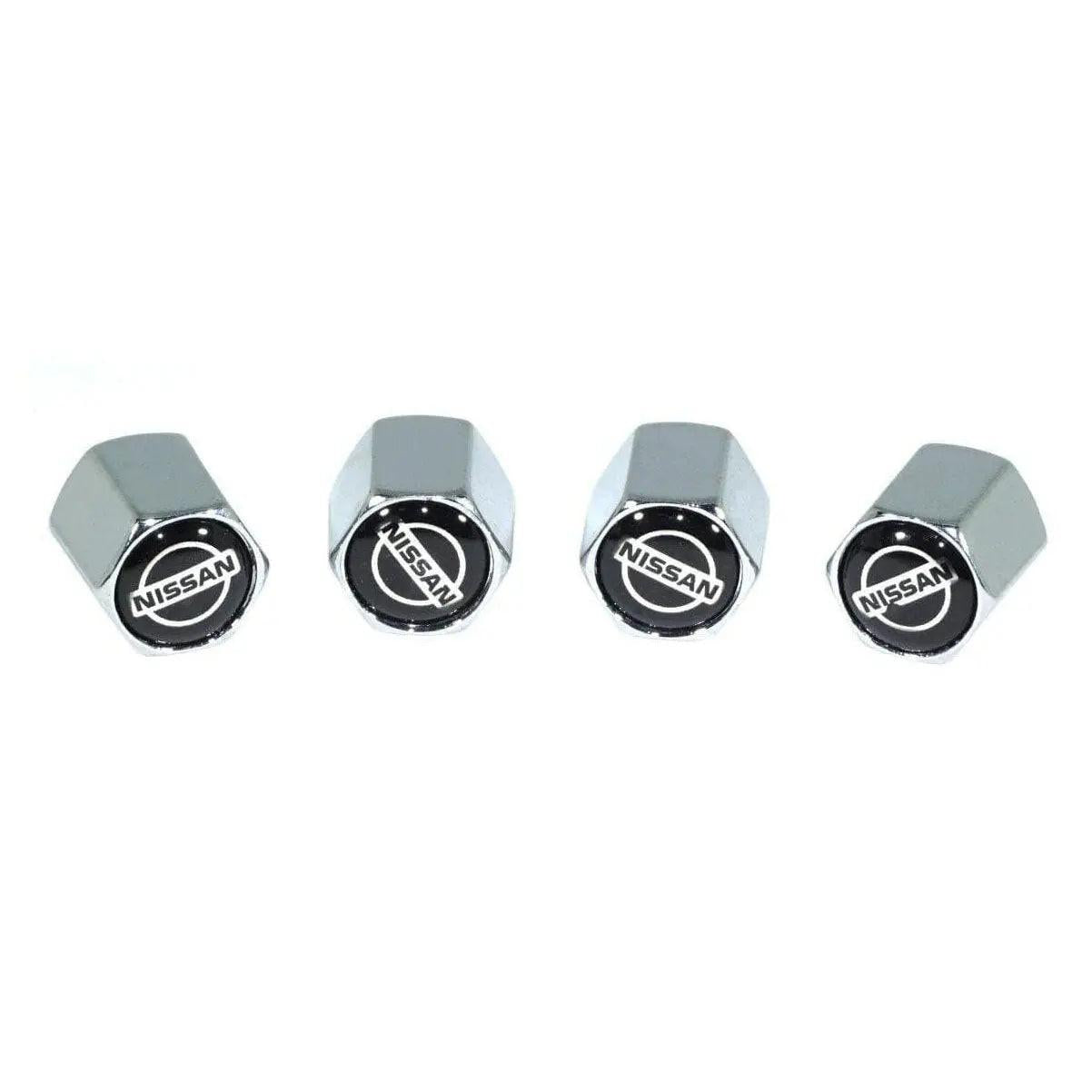 Set of four chrome tire valve stem caps with Nissan logo on white background