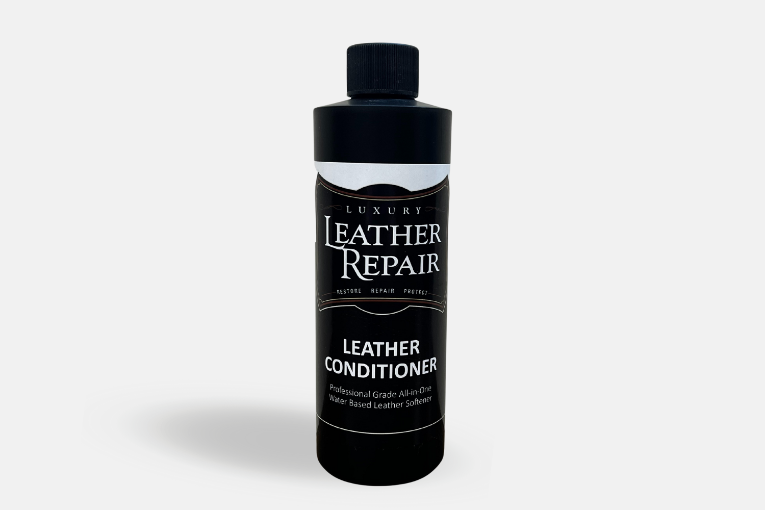 Auto Leather Dye Leather Conditioner 8oz bottle showing smooth leather surface and application nozzle for conditioning and care.