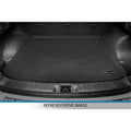 Black cargo trunk liner mat fitted in car boot, textured surface, custom fit accessory.