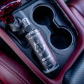 Blackline Car Care Blackline 8oz Wild Cherry Car Air Freshener hanging in a vehicle interior.