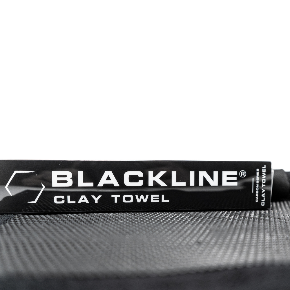Blackline Synthetic Clay Towel for car detailing, black microfiber material designed for removing contaminants from vehicle surfaces.