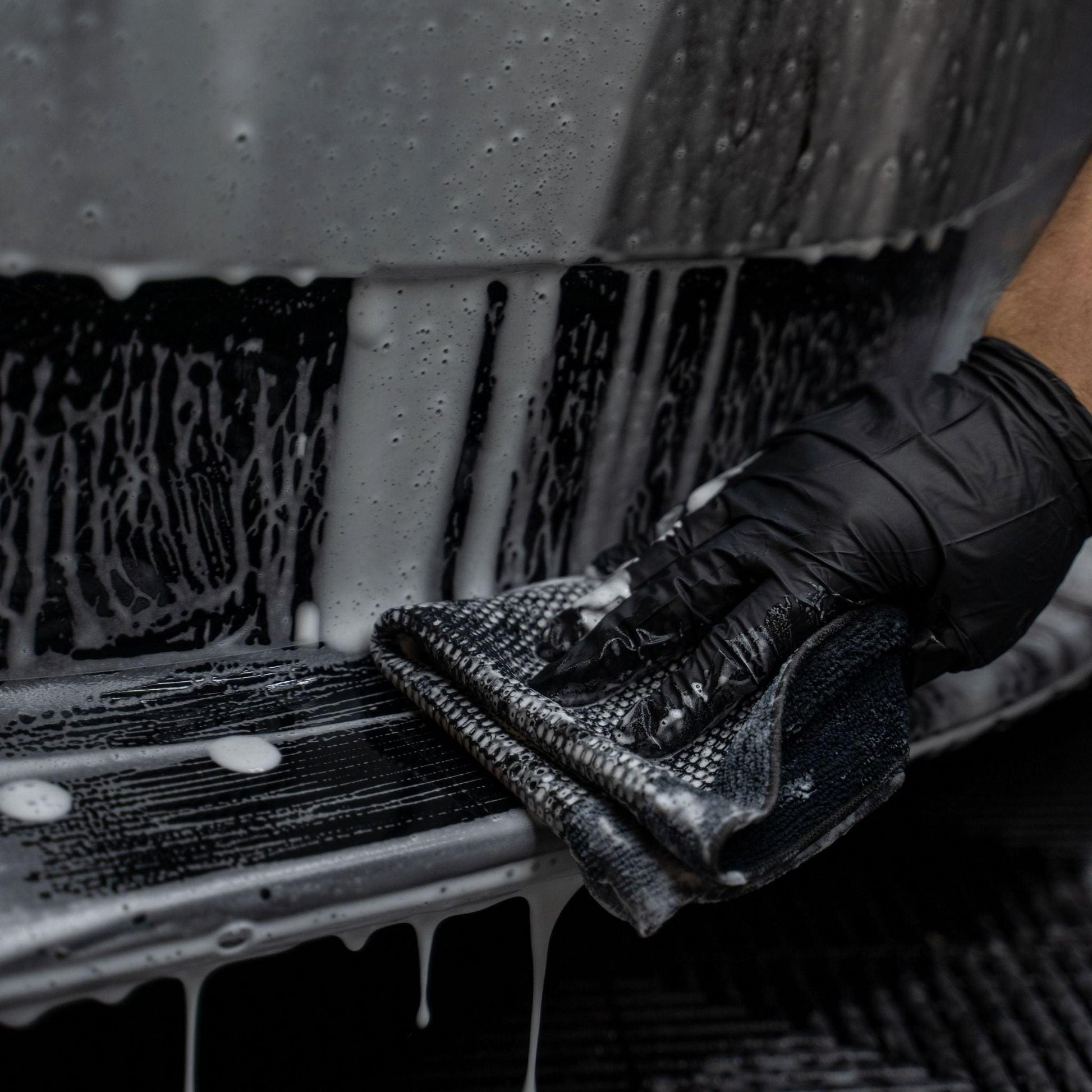 Blackline Synthetic Clay Towel from Blackline Car Care, shown in black, designed for removing contaminants from vehicle surfaces.
