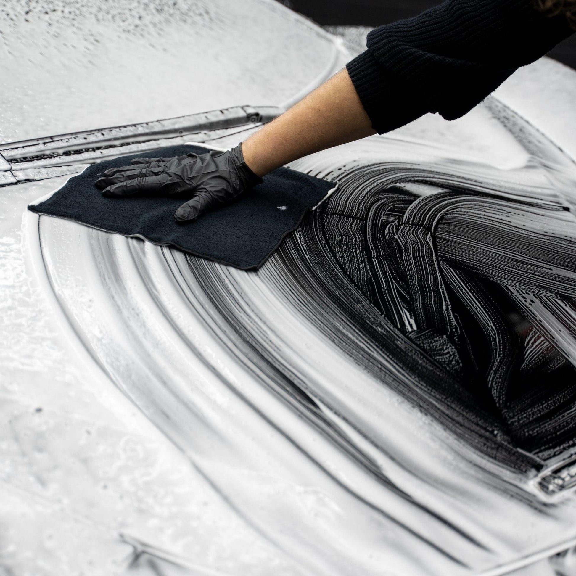 Blackline Synthetic Clay Towel by Blackline Car Care, showcasing its durable, black microfiber surface designed for car detailing.