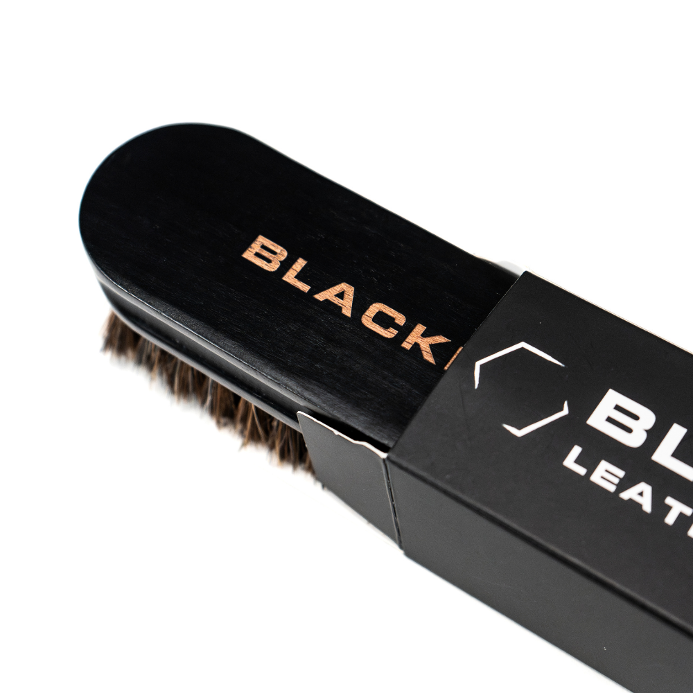 Blackline Car Care Blackline Leather Brush for cleaning and maintaining leather surfaces in vehicles.