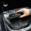 Blackline Leather Brush from Blackline Car Care, designed for cleaning and maintaining leather surfaces in vehicles.