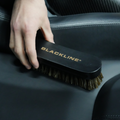 Blackline Car Care BLACKLINE® leather brush with black bristles for cleaning and conditioning leather surfaces in vehicles.