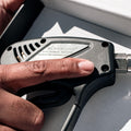 Blackline Car Care black snub-nose pressure washer gun for cleaning and detailing vehicles.