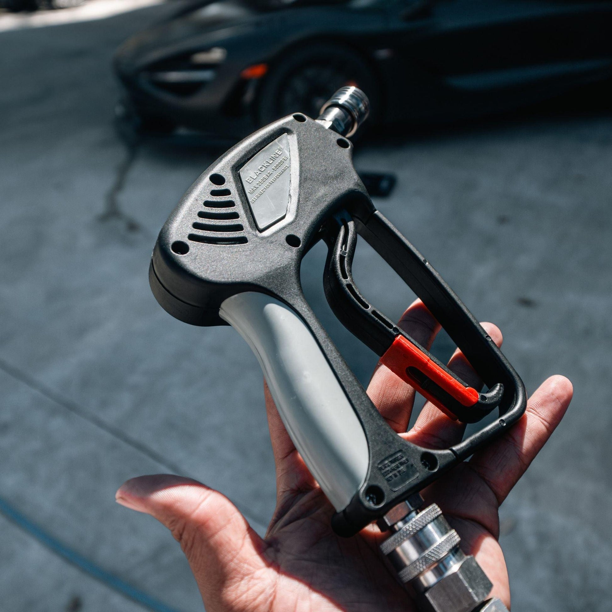 Blackline Car Care SNUB-NOSE pressure washer gun in black, featuring ergonomic design and trigger for efficient cleaning.
