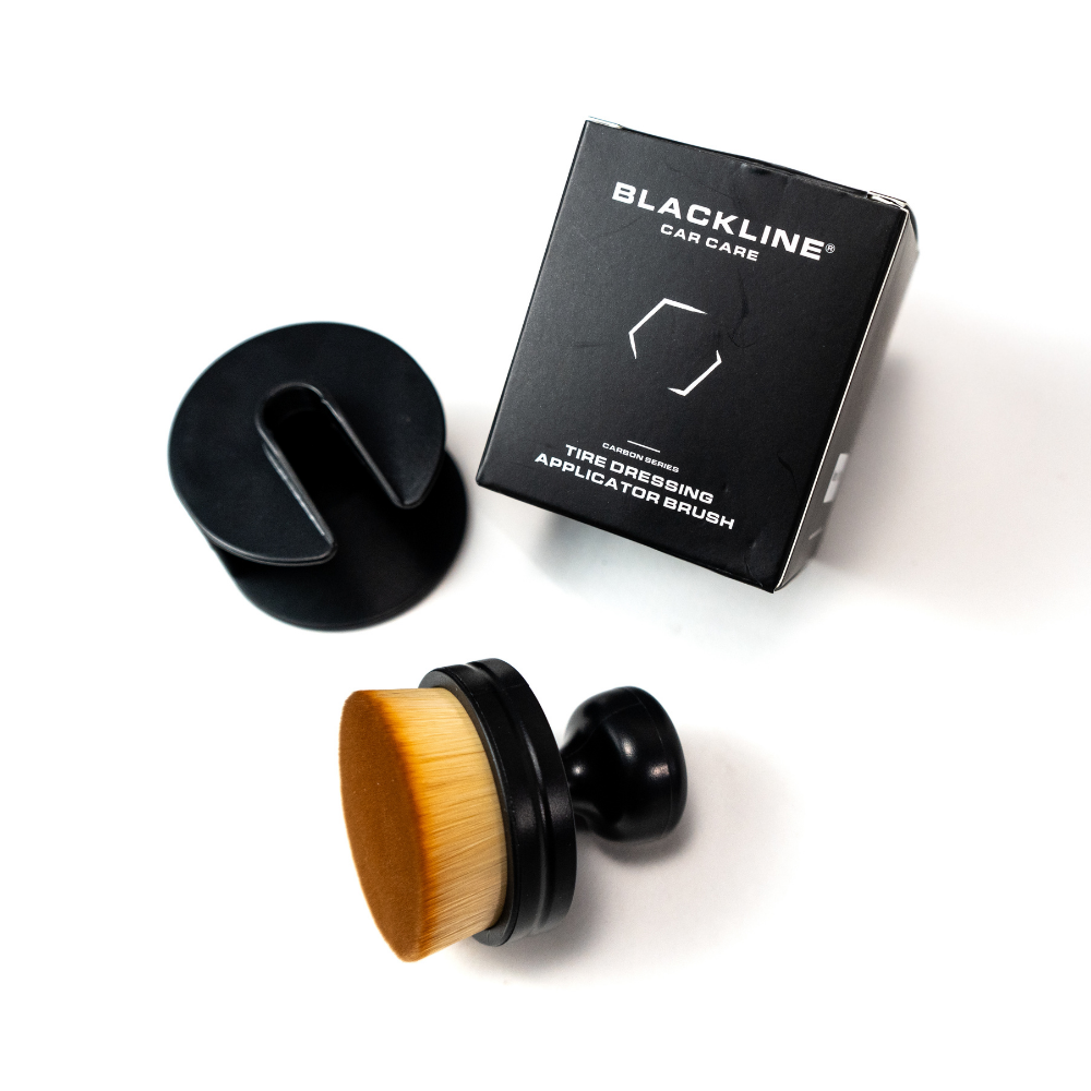 Blackline Car Care BLACKLINE® Tire Applicator Brush with black handle and bristles for applying tire dressing.