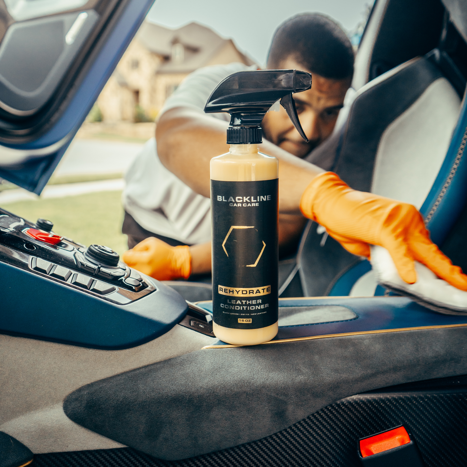 Blackline Car Care BLACKLINE® Rehydrate Leather Conditioner bottle showing label and applicator for restoring leather.