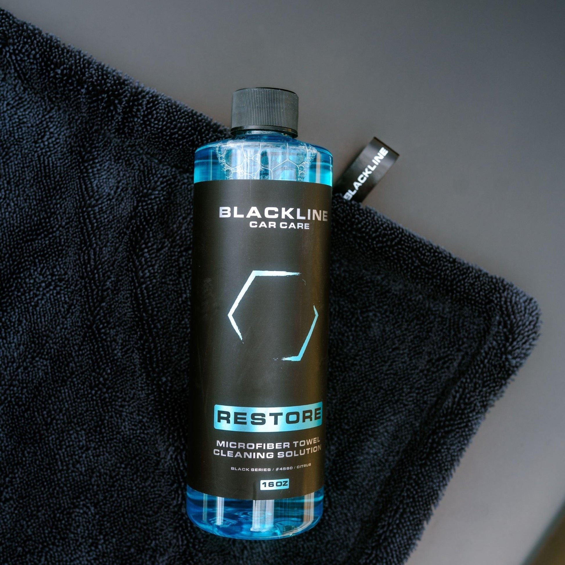 Blackline Car Care BLACKLINE® Restore microfiber detergent bottle, 16oz, for cleaning microfiber car accessories.