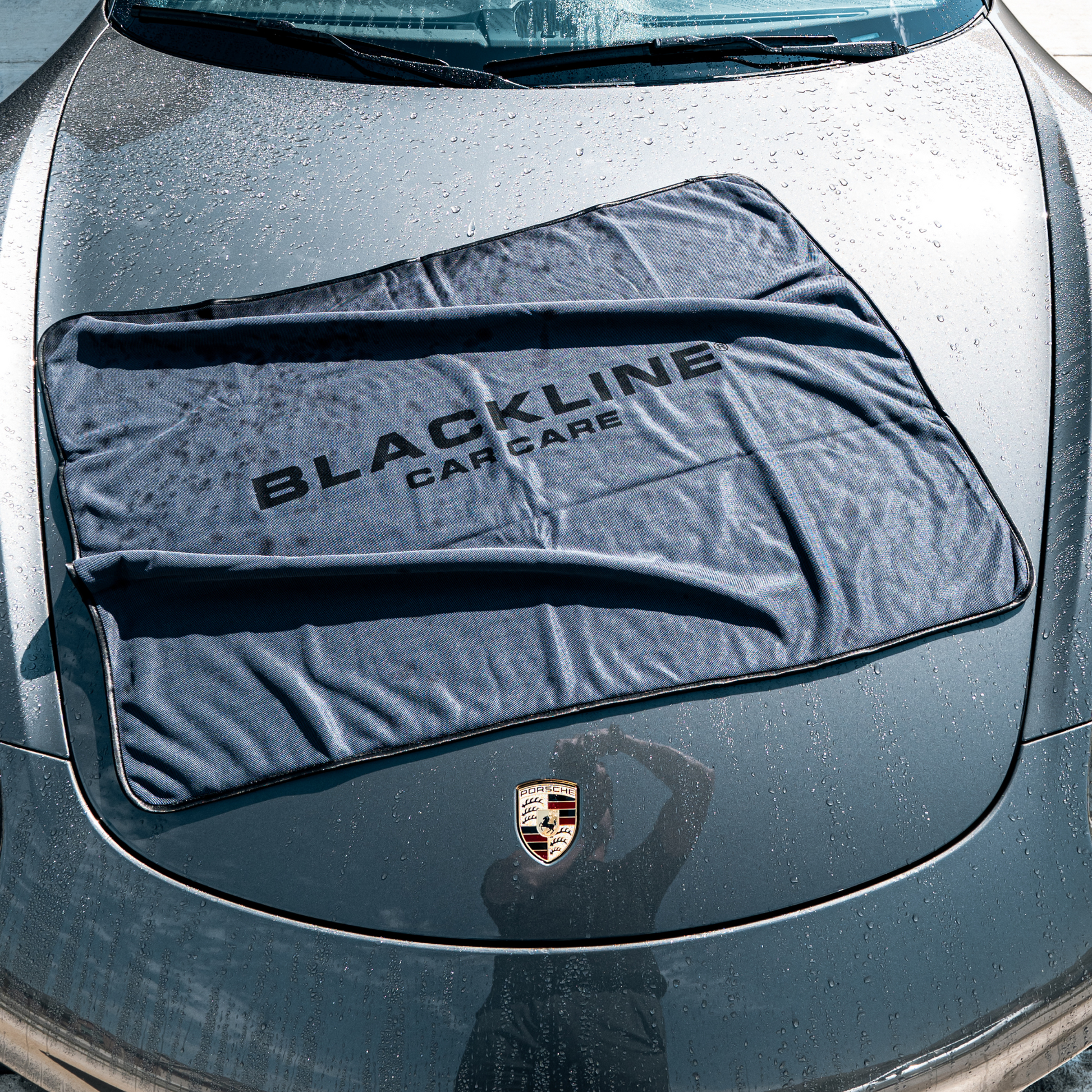 Blackline Car Care BLACKLINE® Slim Twisted-Loop Drying Towel draped over a car for quick, effective drying after washing.