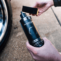 Blackline Car Care BLACKLINE® Blackout Trim & Tire Dressing spray bottle for enhancing trim and tires with a sleek finish.