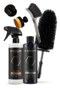 Blackline Car Care BLACKLINE® Blackout Trim & Tire Dressing spray applied to car tires and trim for a sleek, shiny finish.