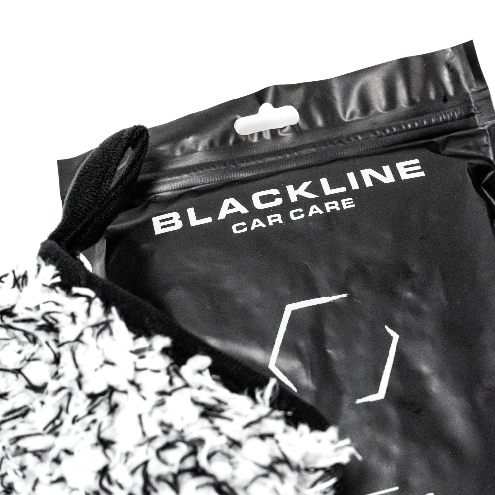 Blackline Car Care microfiber wheel mitt used for cleaning car wheels and rims with soft, absorbent microfiber material.